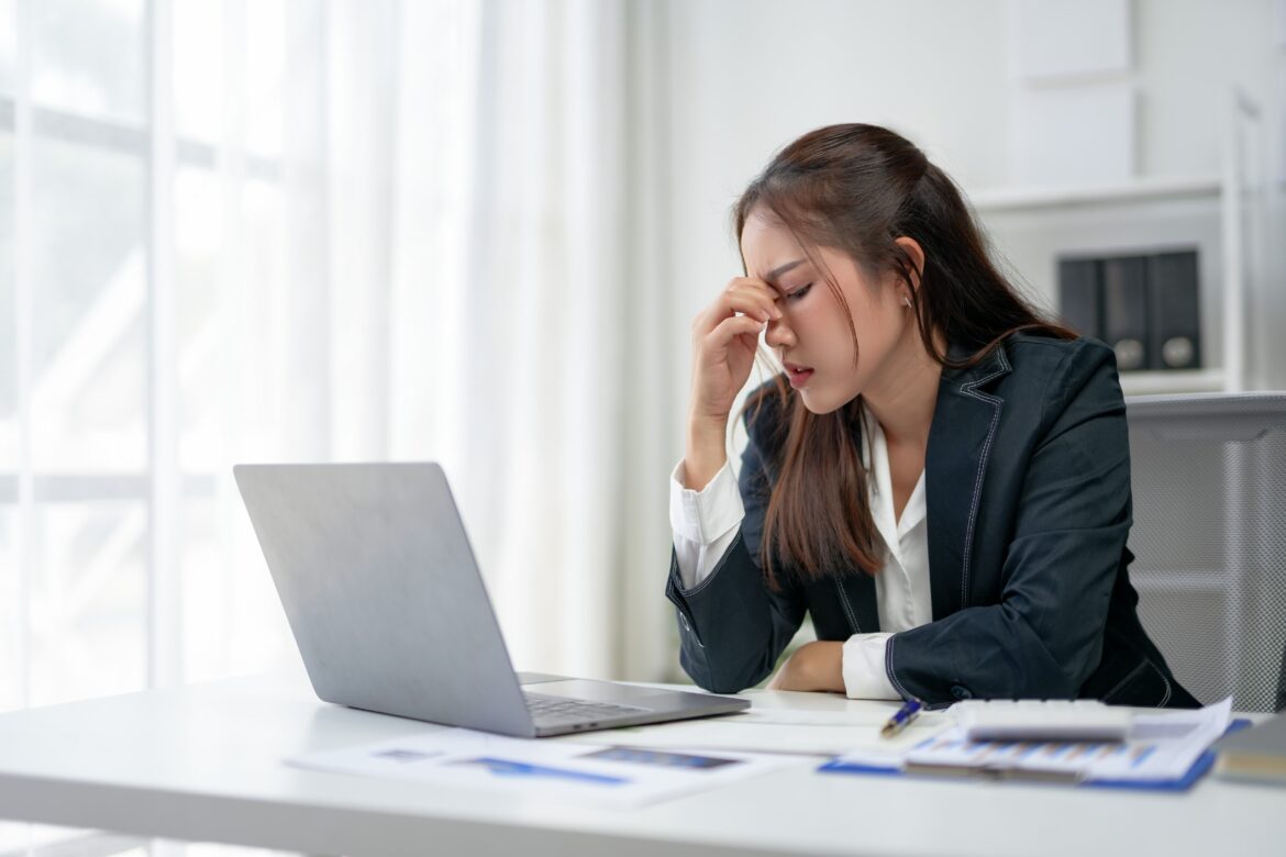 woman feeling stressed while submitting a lot of job application